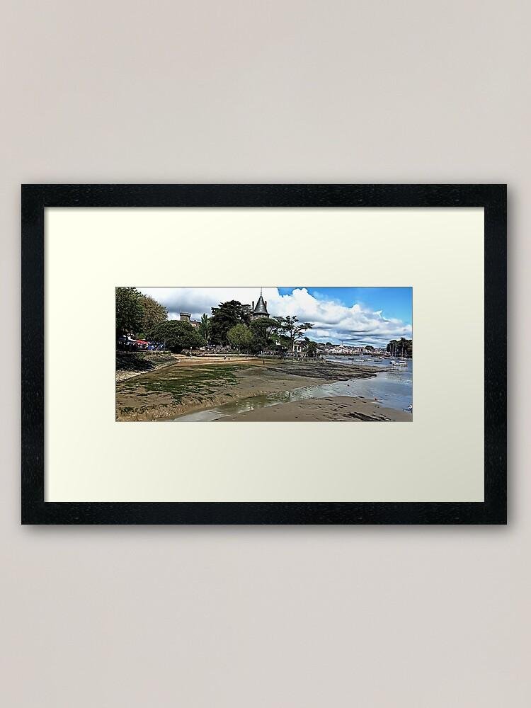 Coastal Charm of Pornic, France 1 Coastal view of Pornic, France, with sandy shoreline, historic buildings, and a bright blue sky.