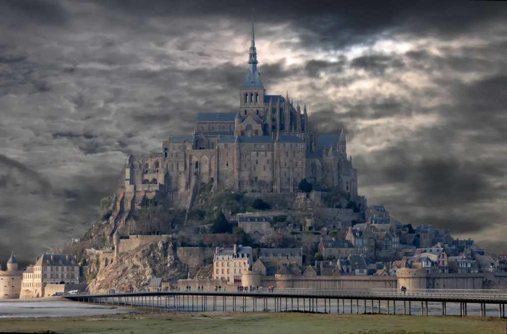 Mont Saint-Michel rising from the bay under dark dramatic clouds in Normandy